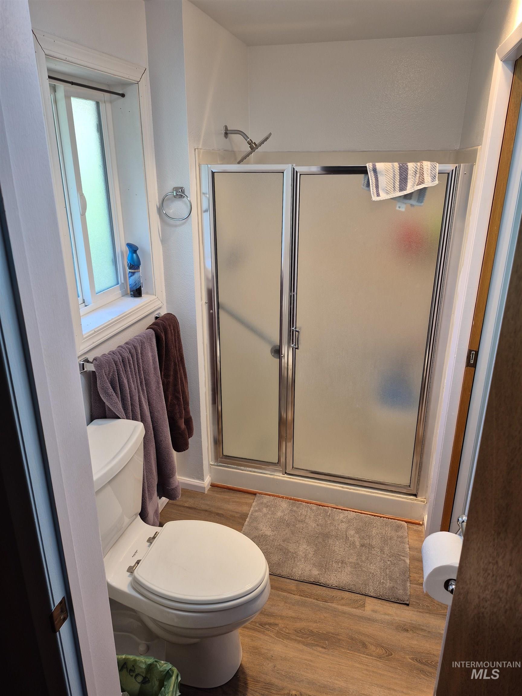 701 Wheeler Street Kendrick, ID 83537 - Photo 20 of 32 Bathroom featuring light wood finished floors and a shower stall