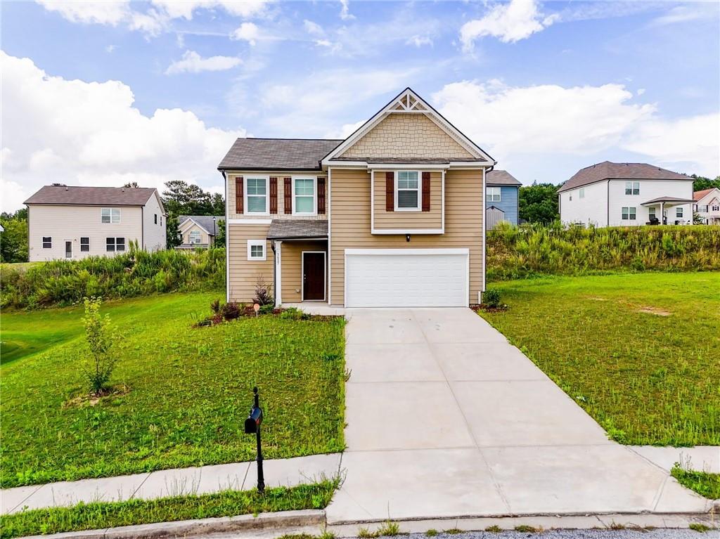 7627 Apostle Road Fairburn, GA 30213 - Photo 1 of 1 a front view of a house with a yard