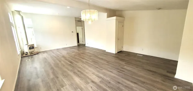 a view of a livingroom with wooden floor