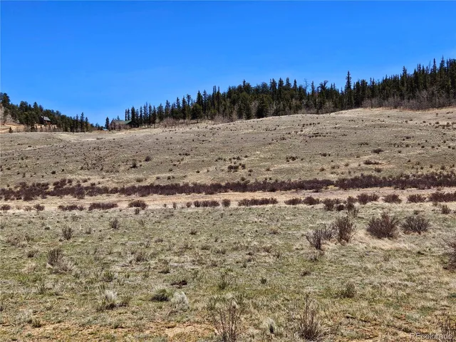a view of ocean beach and mountain