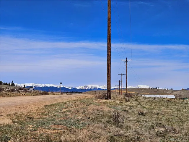 a view of a ocean with a building in the background