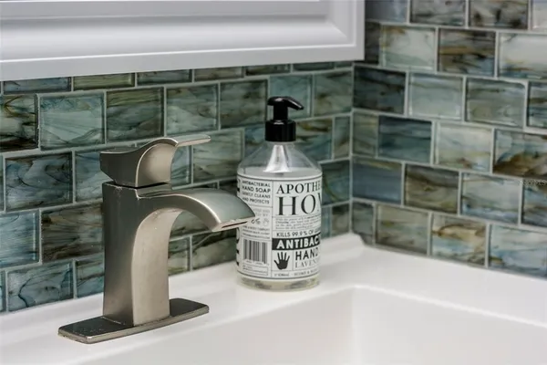 a bedroom with a bed and lamps