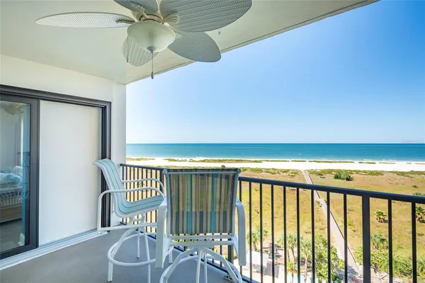 a view of a dining room with furniture and a table