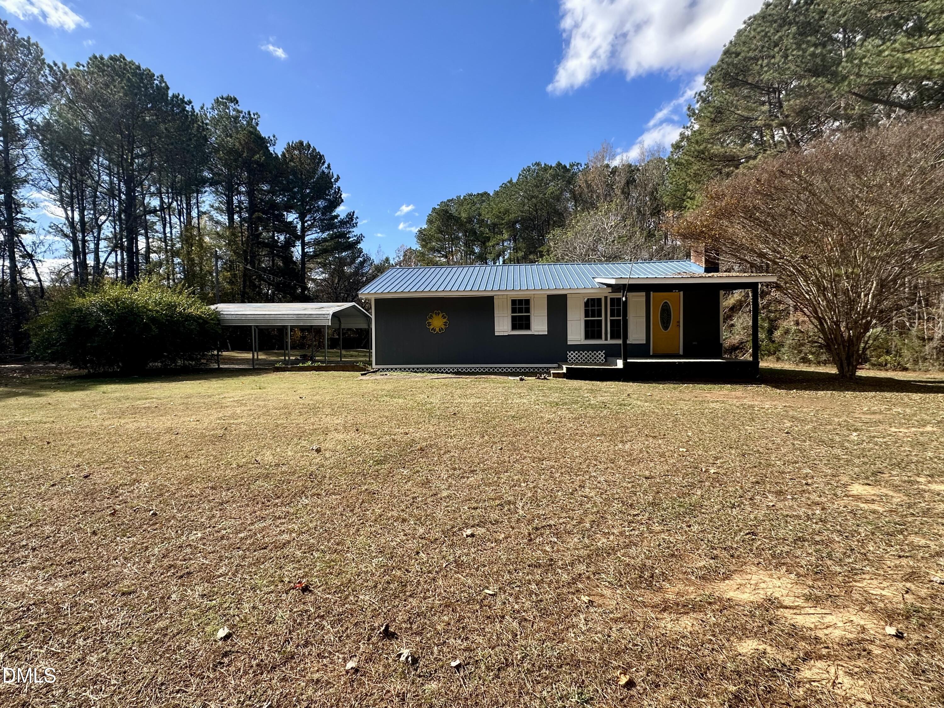 8205 Old Switchboard Road Snow Camp, NC 27349 - Photo 2 of 25 a view of a house with a yard