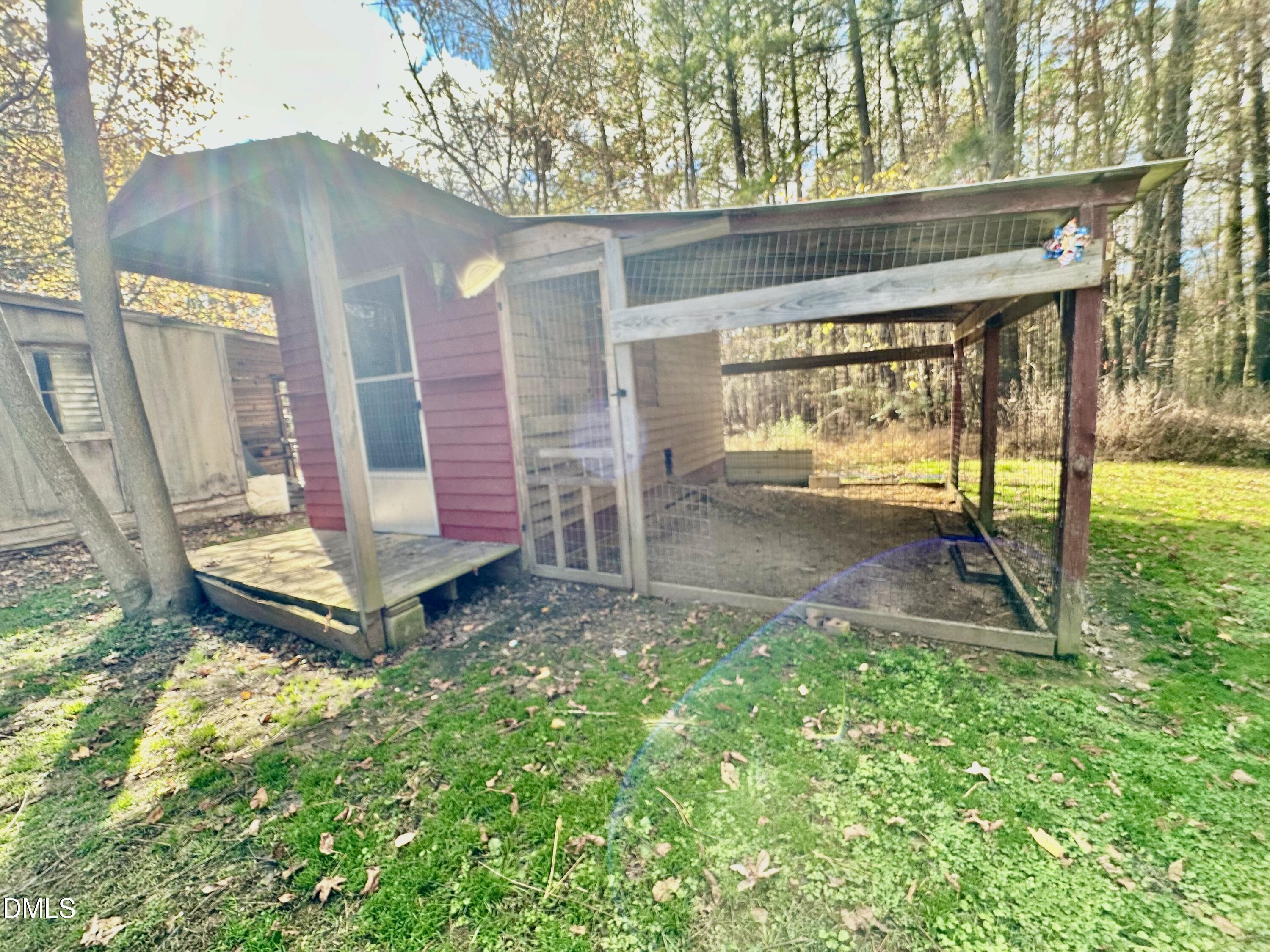8205 Old Switchboard Road Snow Camp, NC 27349 - Photo 23 of 25 a backyard of a house with table and chairs