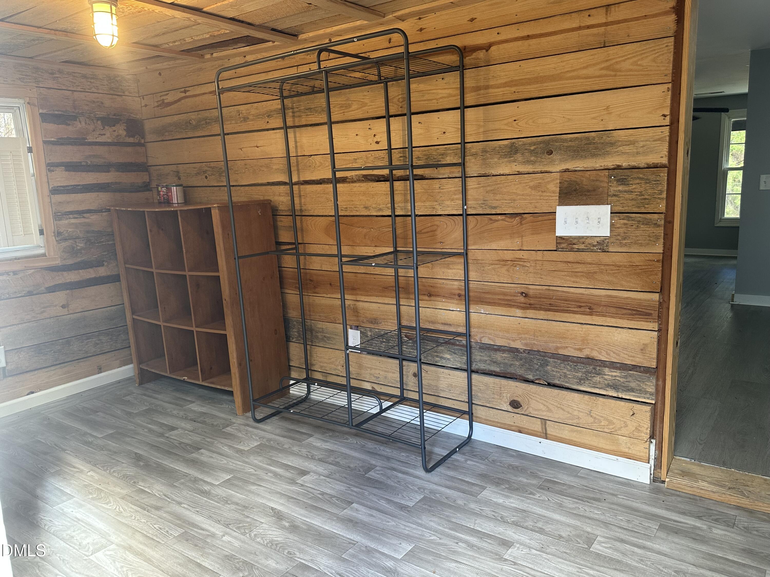 8205 Old Switchboard Road Snow Camp, NC 27349 - Photo 10 of 25 a view of a room with wooden floor and white walls