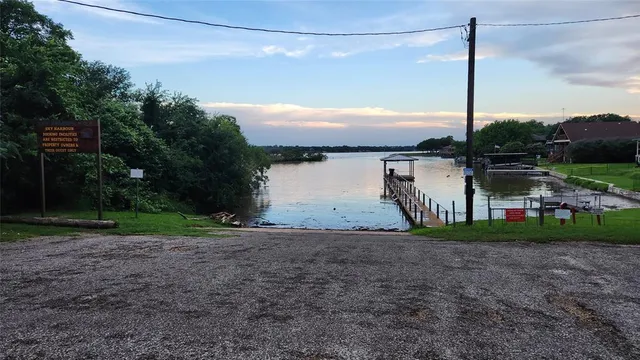 a view of a house with a yard and a garage