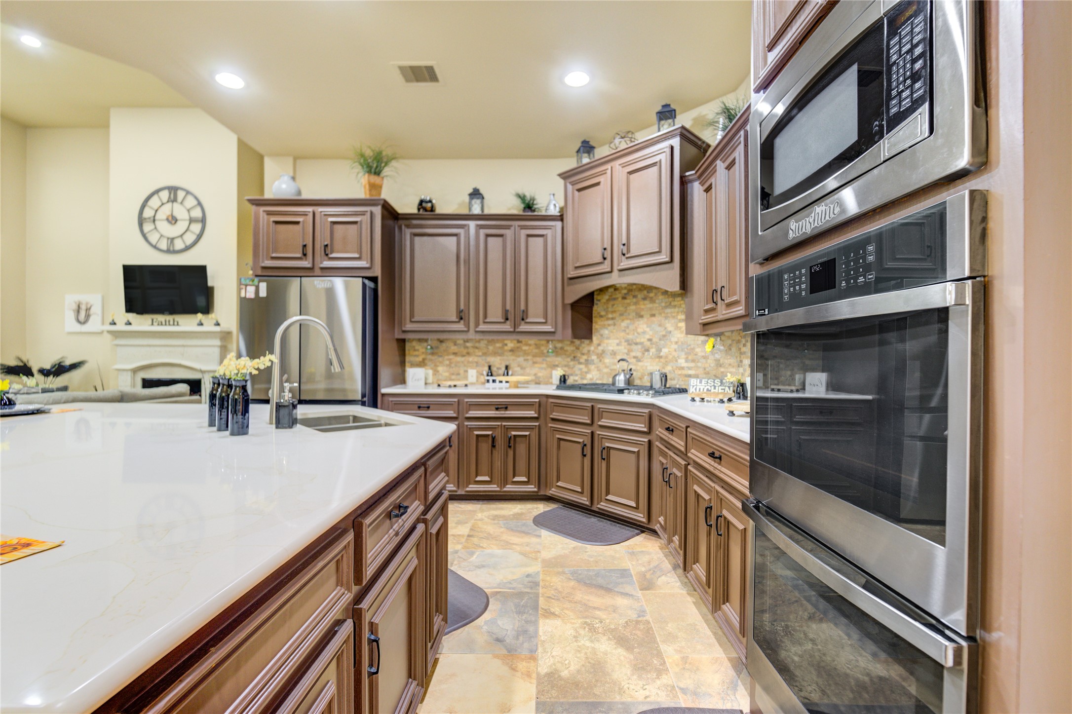 25831 Morgan Springs Spring, TX 77373 - Photo 17 of 49 a kitchen with stainless steel appliances granite countertop a refrigerator and a stove top oven
