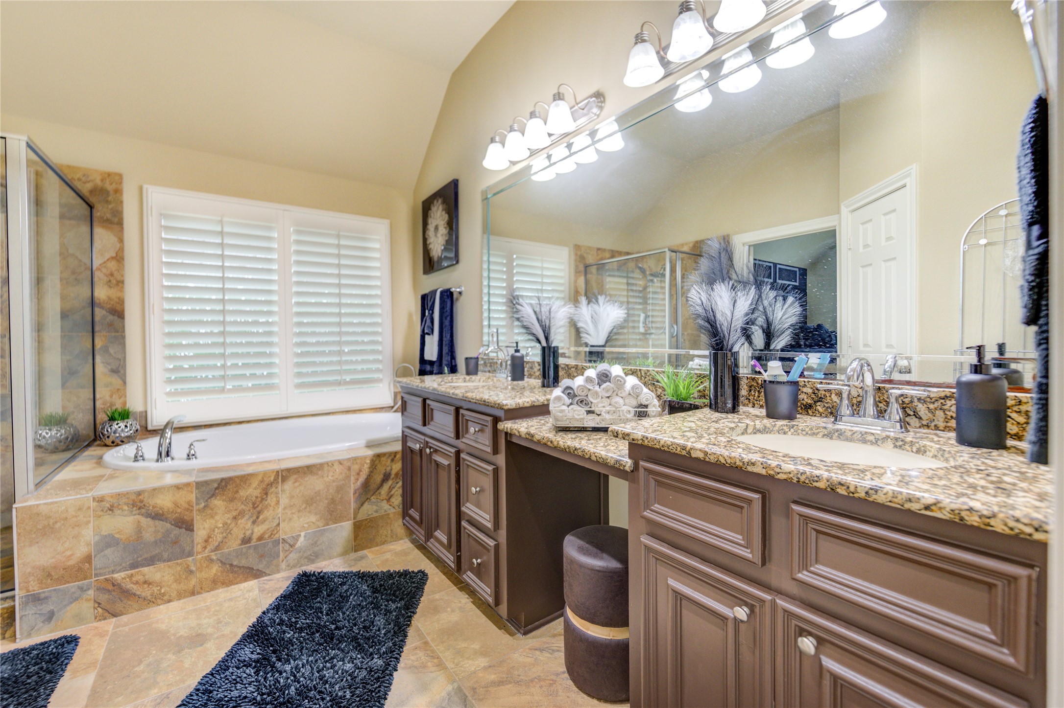 25831 Morgan Springs Spring, TX 77373 - Photo 21 of 49 a spacious bathroom with a granite countertop sink a large mirror and a bathtub