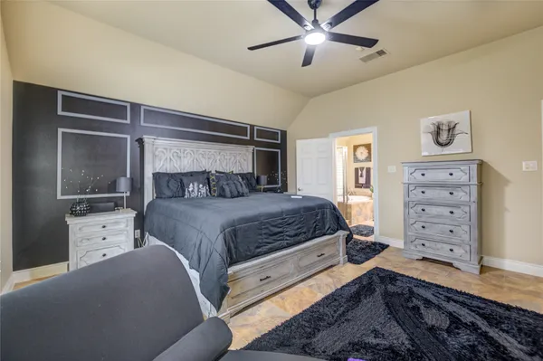 a large bathroom with a large tub and sink