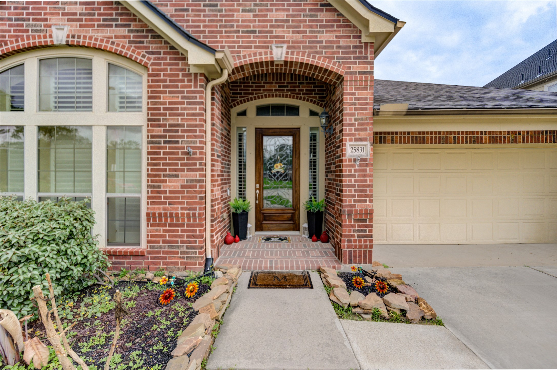 25831 Morgan Springs Spring, TX 77373 - Photo 3 of 49 a front view of a house with a garden