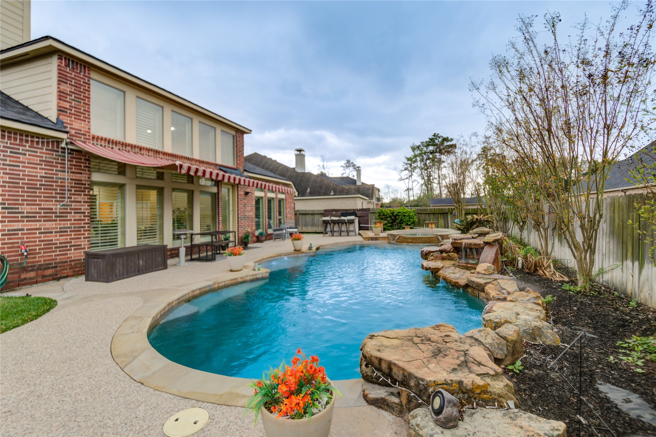25831 Morgan Springs Spring, TX 77373 - Photo 42 of 49 a front view of a house with swimming pool and furniture