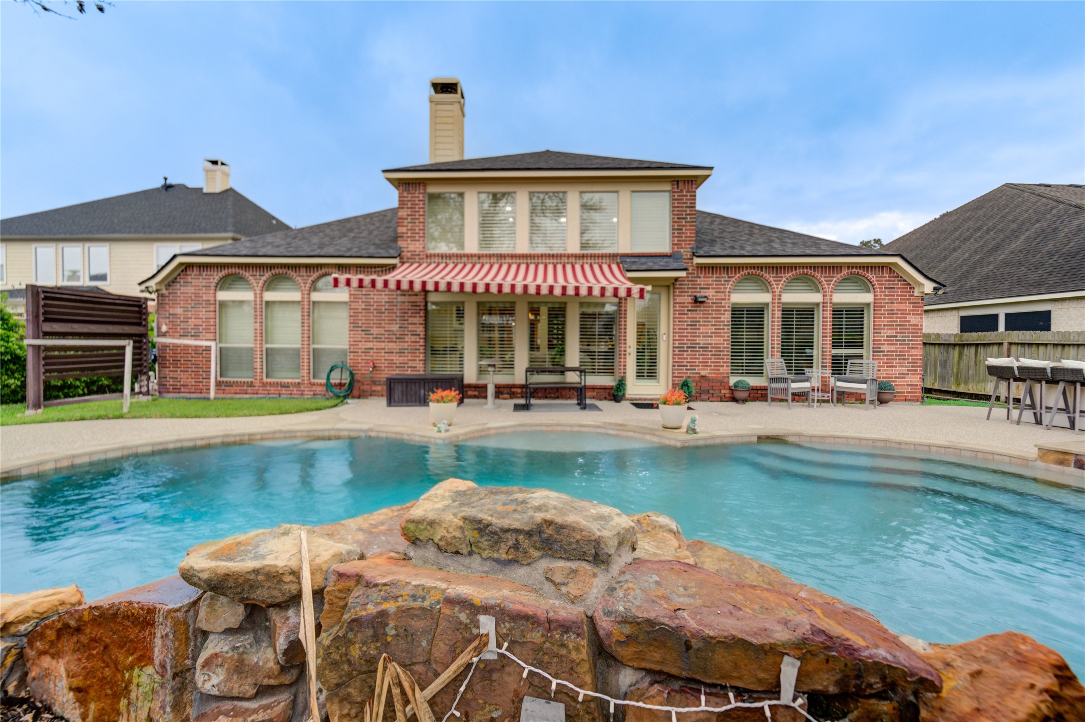 25831 Morgan Springs Spring, TX 77373 - Photo 44 of 49 a front view of a house with swimming pool having outdoor seating