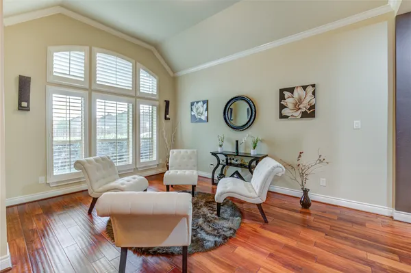 a living room filled with furniture and a large window