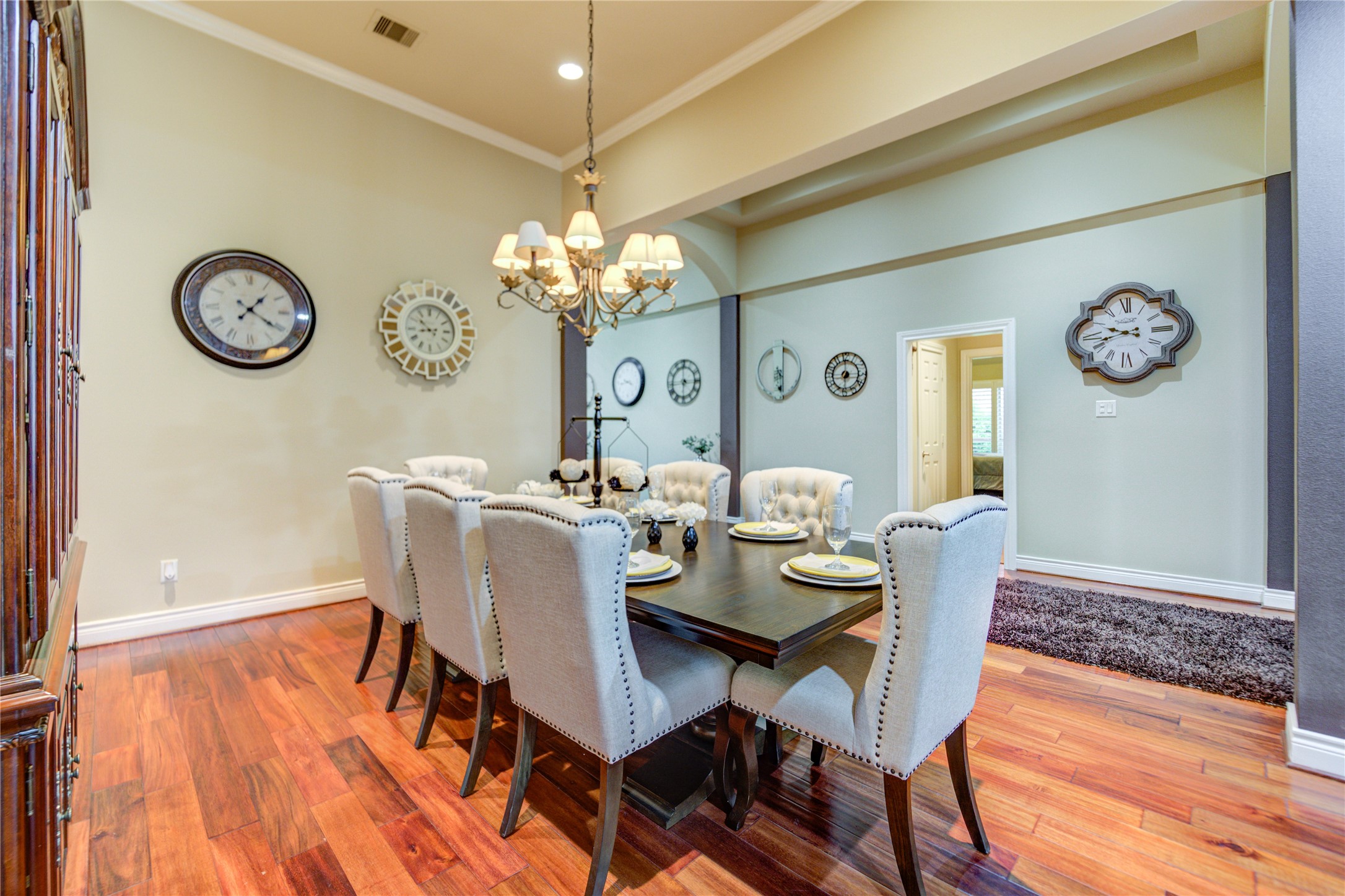 25831 Morgan Springs Spring, TX 77373 - Photo 10 of 49 a view of a dining room with furniture a chandelier and wooden floor