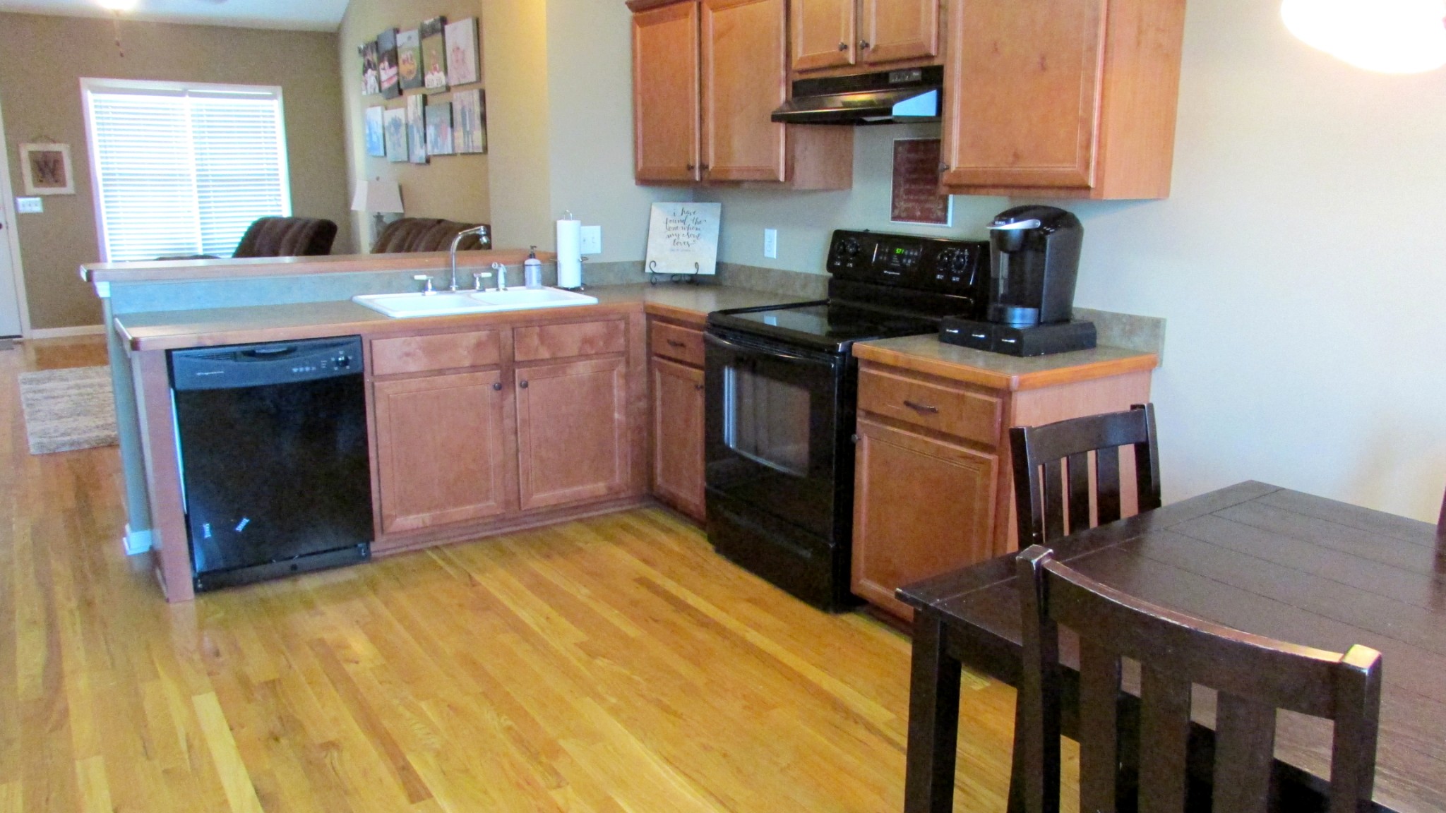 618 Berry Circle Springfield, TN 37172 - Photo 8 of 22 a kitchen with stainless steel appliances granite countertop a stove a sink dishwasher and a microwave oven with cabinets