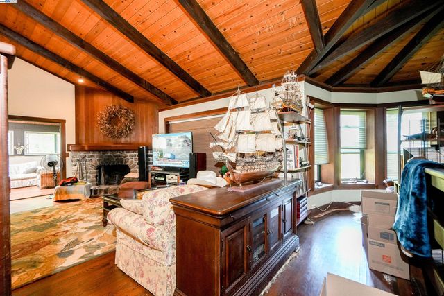 a dining room with furniture and wooden floor