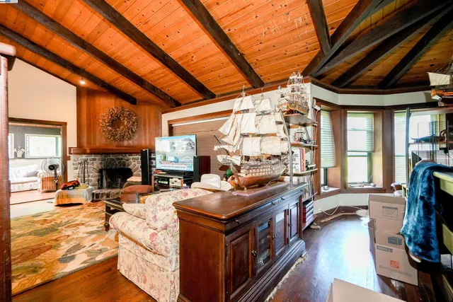 a dining room with furniture and wooden floor