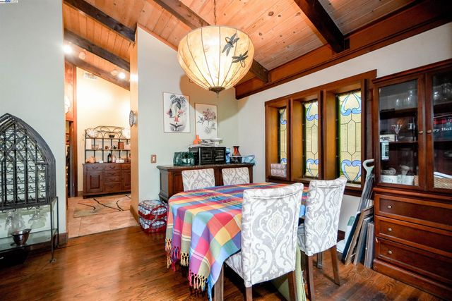 a view of a kitchen with fridge and rack