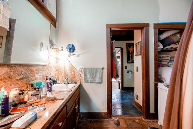 a living room with furniture and large windows