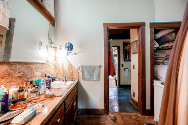 a living room with furniture and large windows