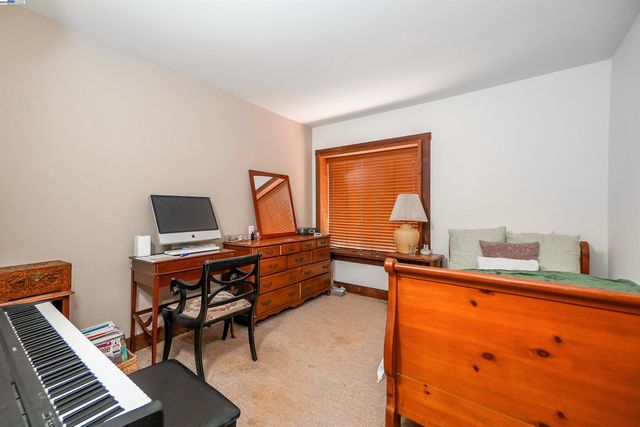 a bunch of flowers in front of a house