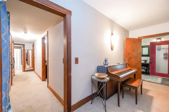 a view of a house with backyard sitting area and garden