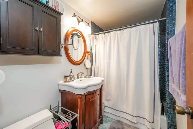 a patio with a patio table and chairs under an umbrella