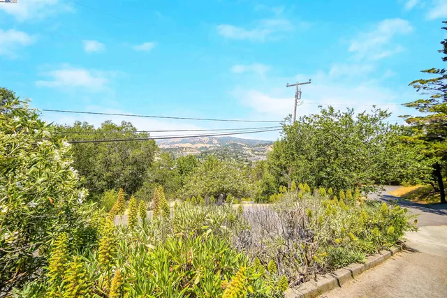 a view of a chairs and table in a patio