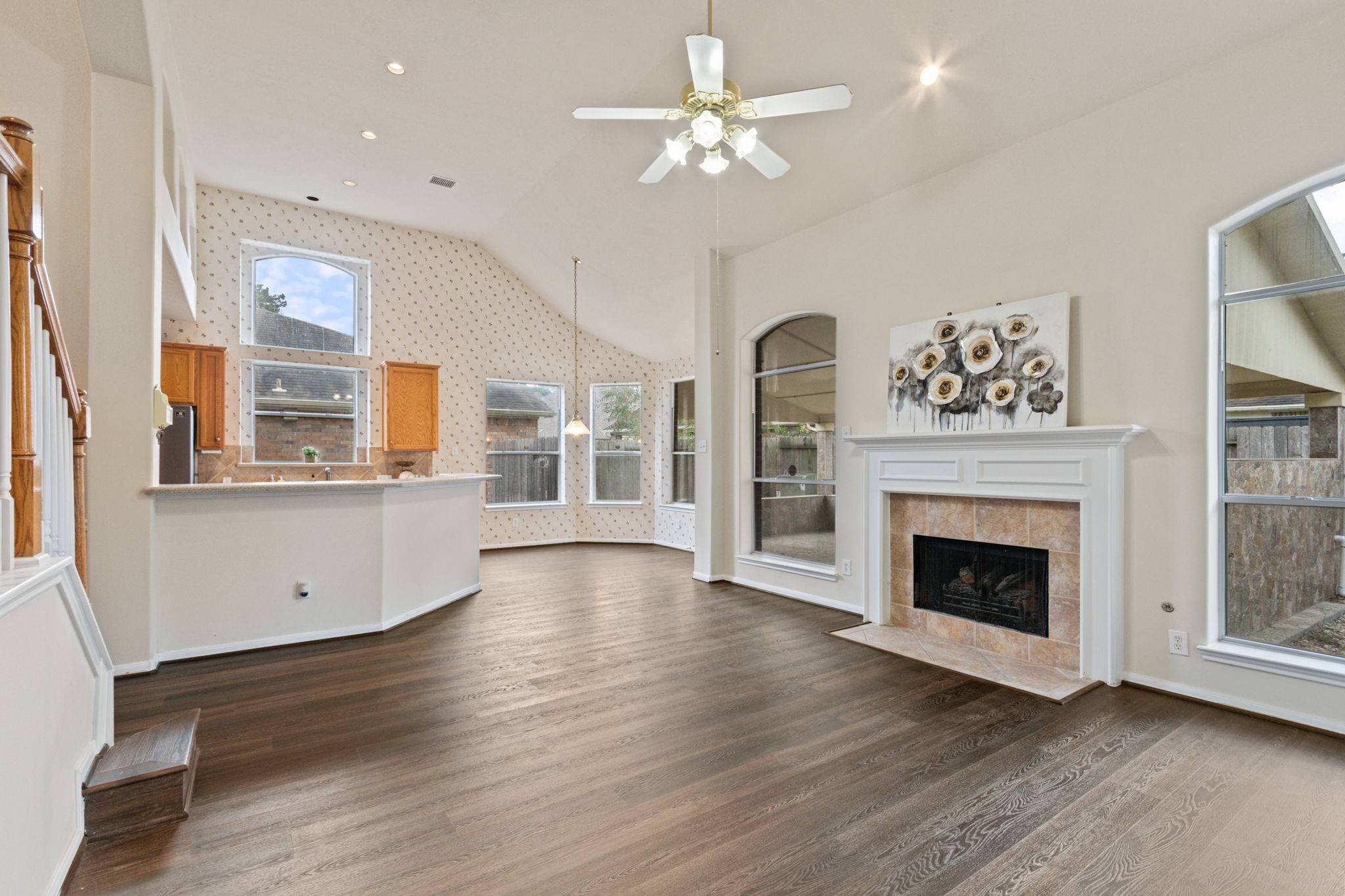 20907 Divellec Lane Spring, TX 77388 - Photo 13 of 50 This spacious living area seamlessly connects to an open kitchen with a breakfast bar, perfect for entertaining.