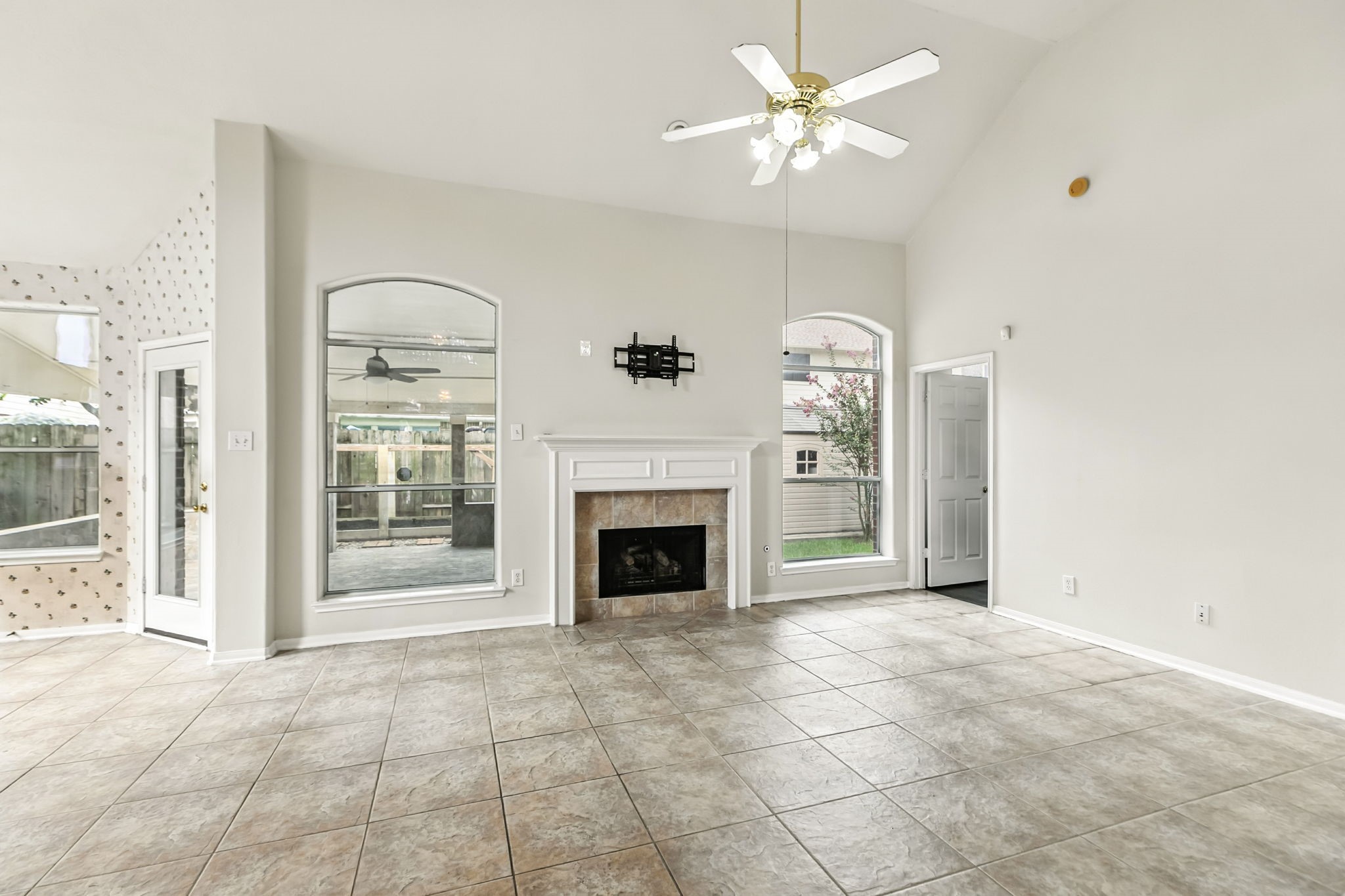 20907 Divellec Lane Spring, TX 77388 - Photo 13 of 46 a view of a livingroom with a fireplace and a chandelier fan
