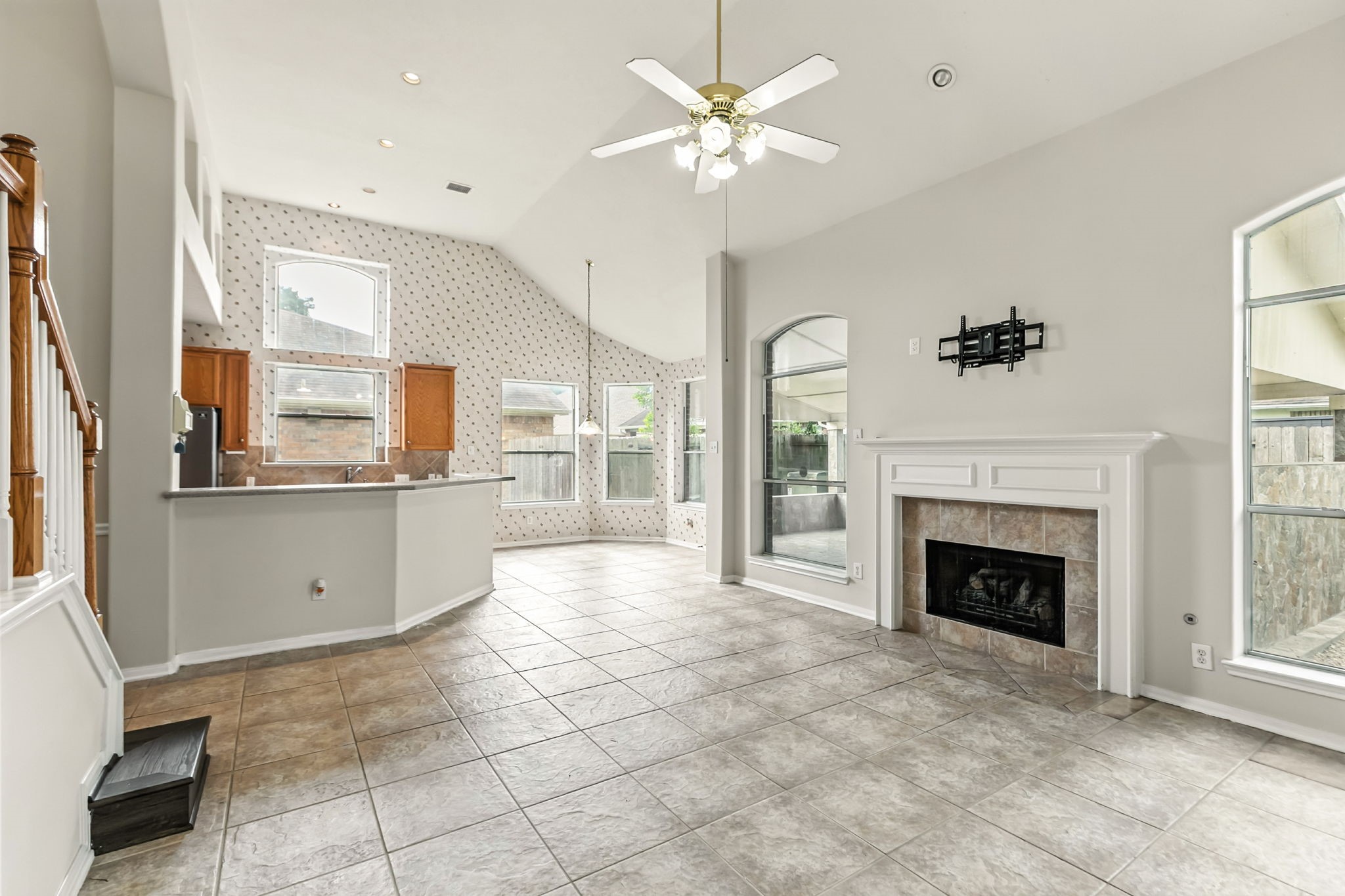 20907 Divellec Lane Spring, TX 77388 - Photo 14 of 46 a view of a kitchen with furniture and a fireplace