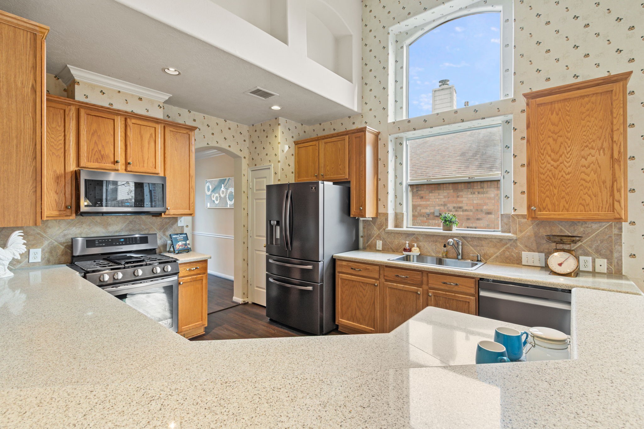 20907 Divellec Lane Spring, TX 77388 - Photo 15 of 50 Notice the newer appliances and gas stove.
