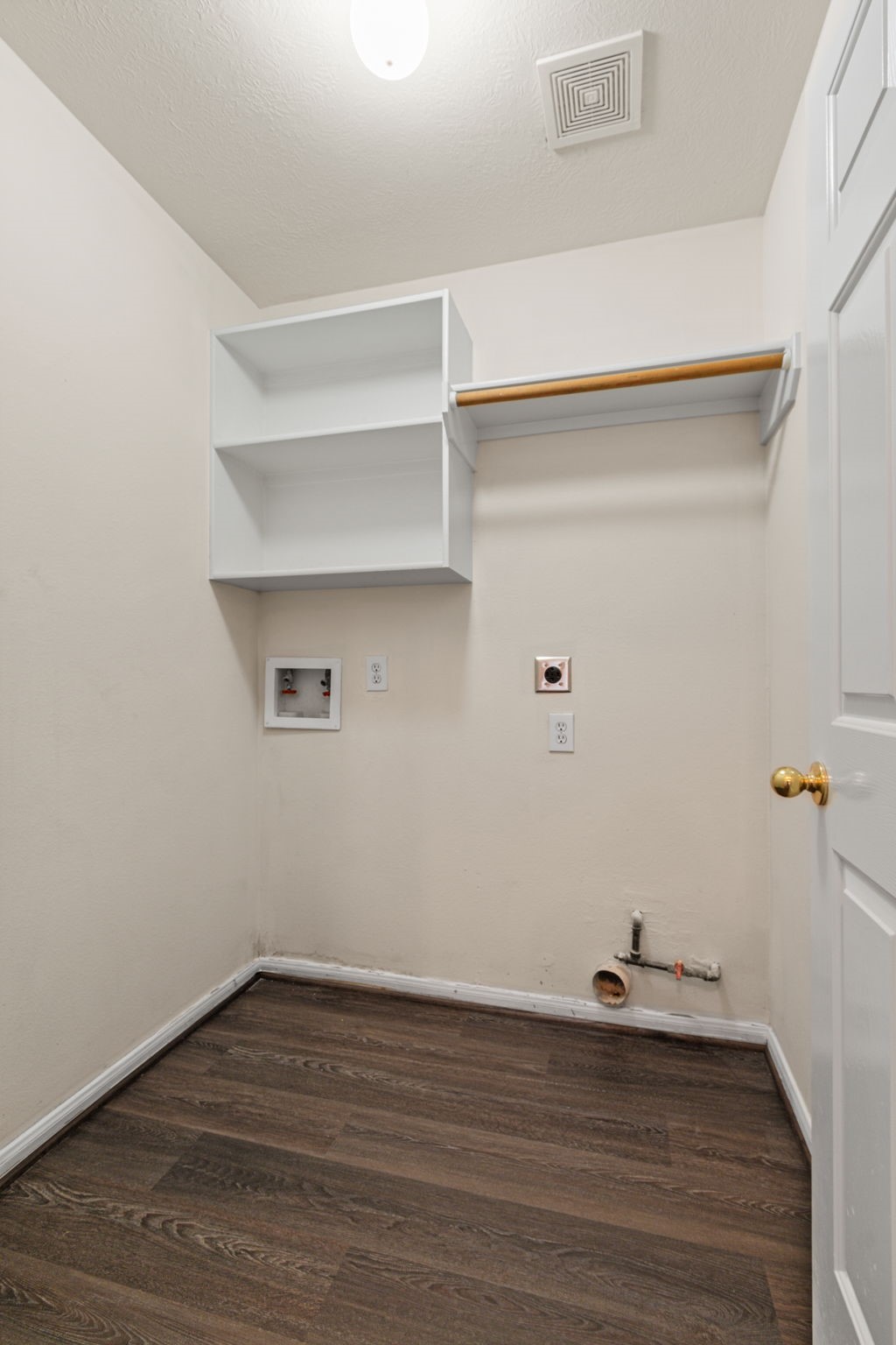 20907 Divellec Lane Spring, TX 77388 - Photo 22 of 50 The laundry room features shelves for storage.