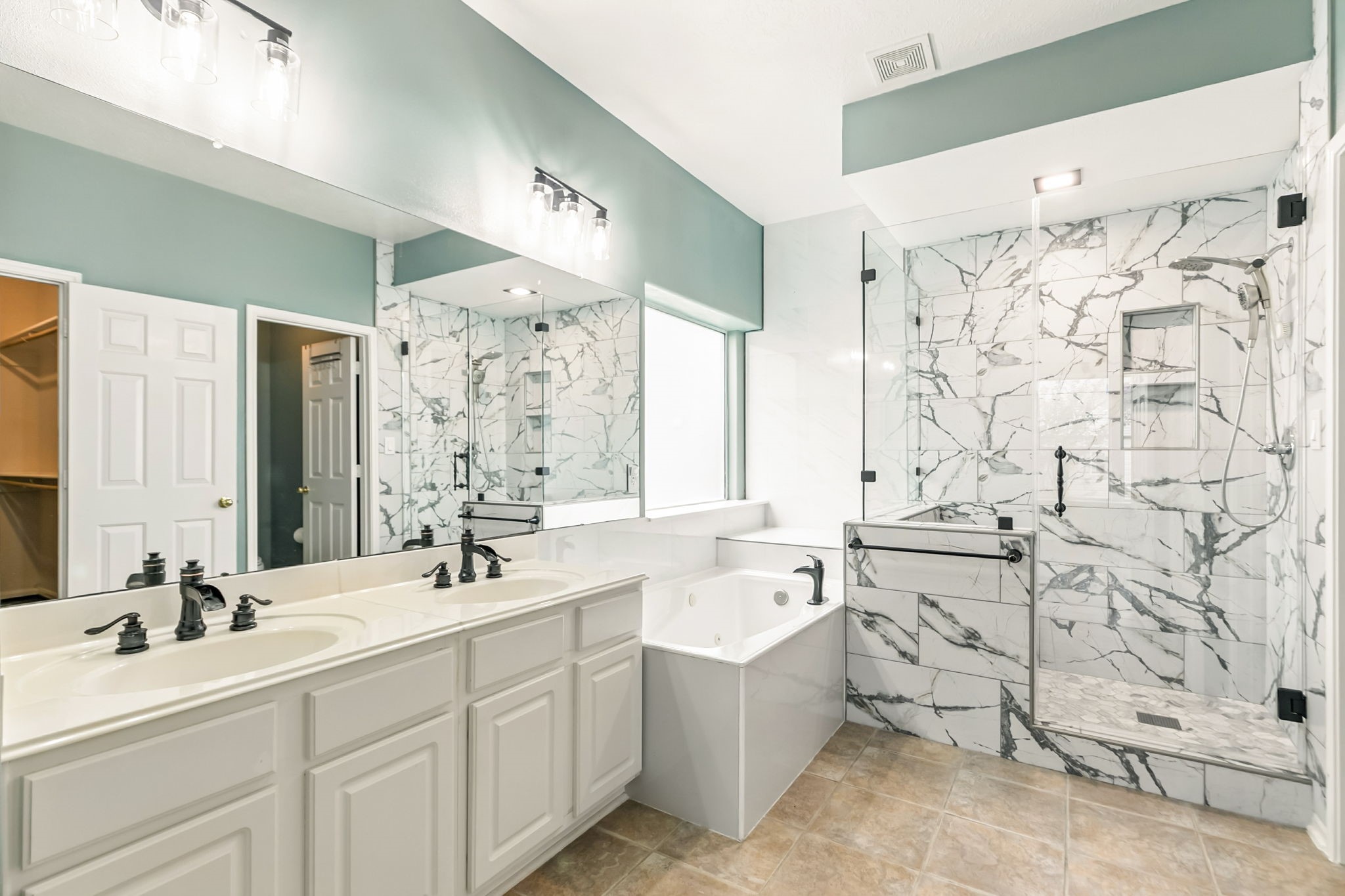 20907 Divellec Lane Spring, TX 77388 - Photo 26 of 50 The bathroom was remodeled with a luxurious shower.