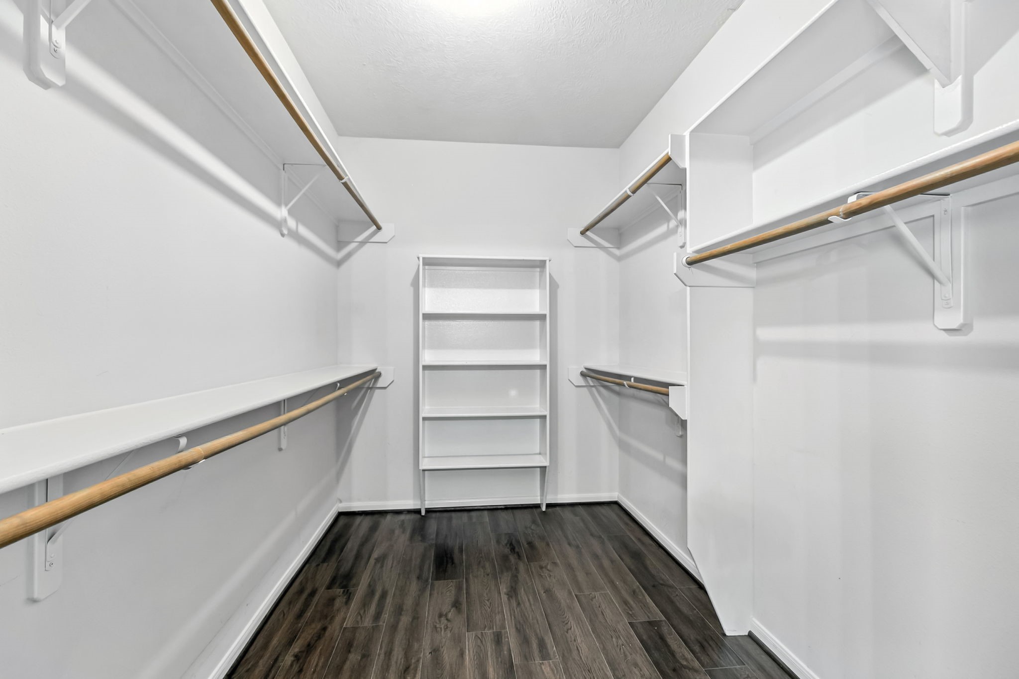 20907 Divellec Lane Spring, TX 77388 - Photo 27 of 46 a view of walk in closet with empty racks
