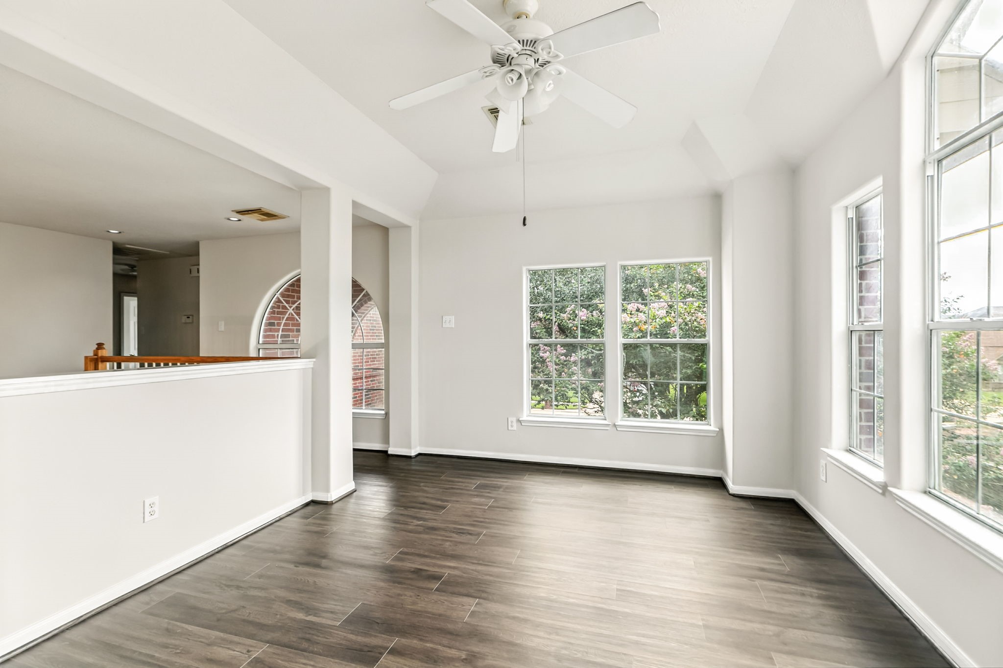 20907 Divellec Lane Spring, TX 77388 - Photo 31 of 50 a view of a big room with wooden floor and windows