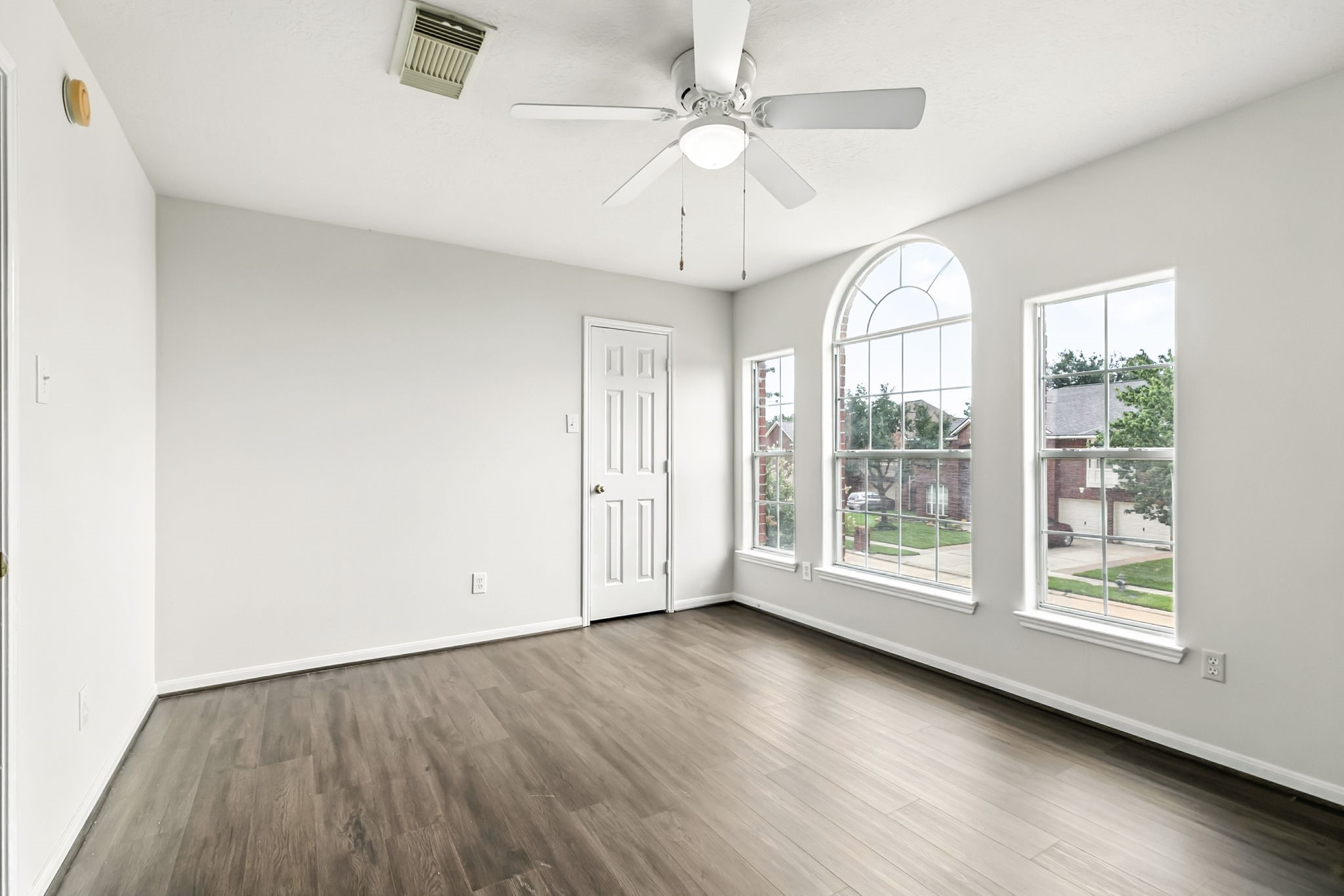 20907 Divellec Lane Spring, TX 77388 - Photo 32 of 50 wooden floor in an empty room with a window