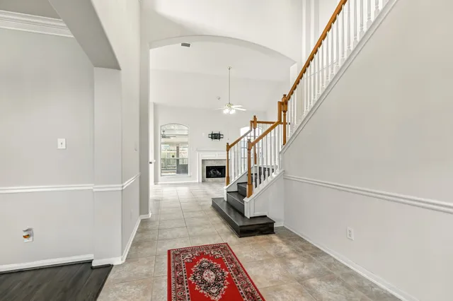 a view of entryway with stairs and wooden floor
