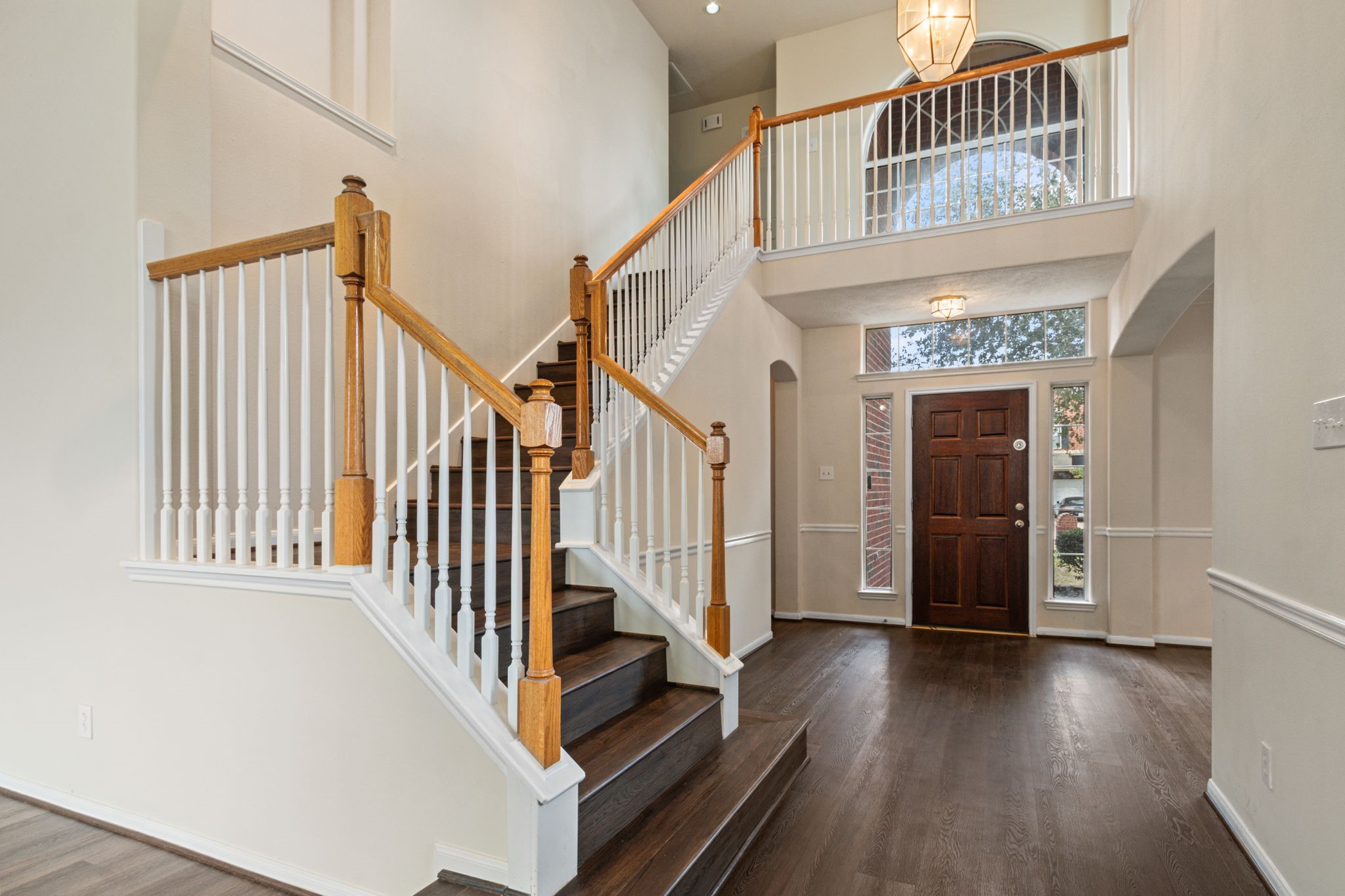 20907 Divellec Lane Spring, TX 77388 - Photo 10 of 50 a view of staircase with lots of frames on wall and a window