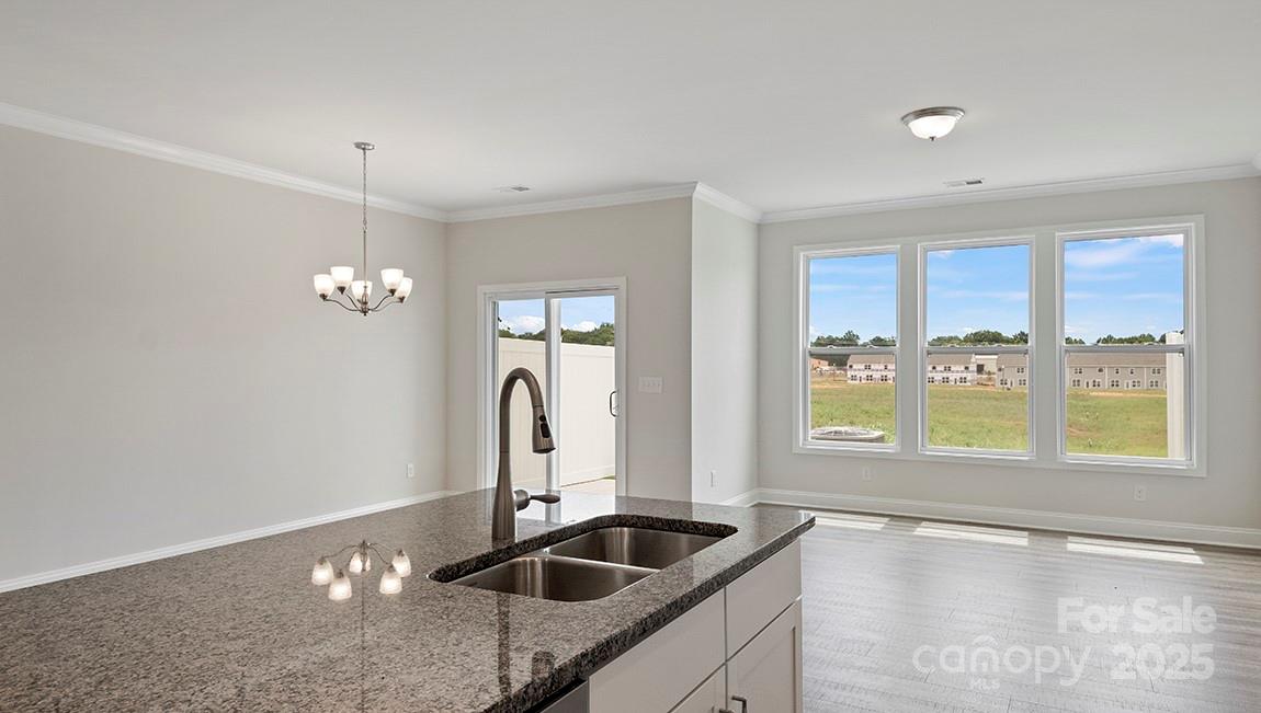 367 Lagoon Road Fletcher, NC 28732 - Photo 7 of 30 a kitchen with granite countertop a sink and a window