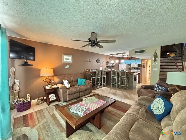 a living room with furniture and a table