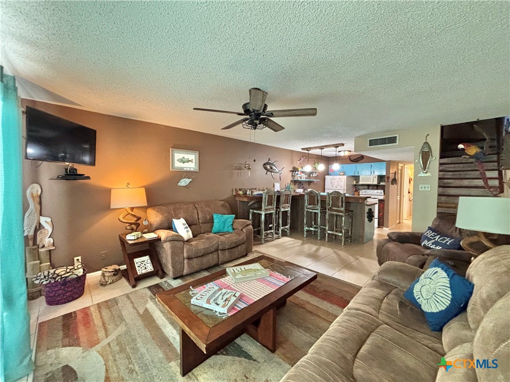 a living room with furniture and a table