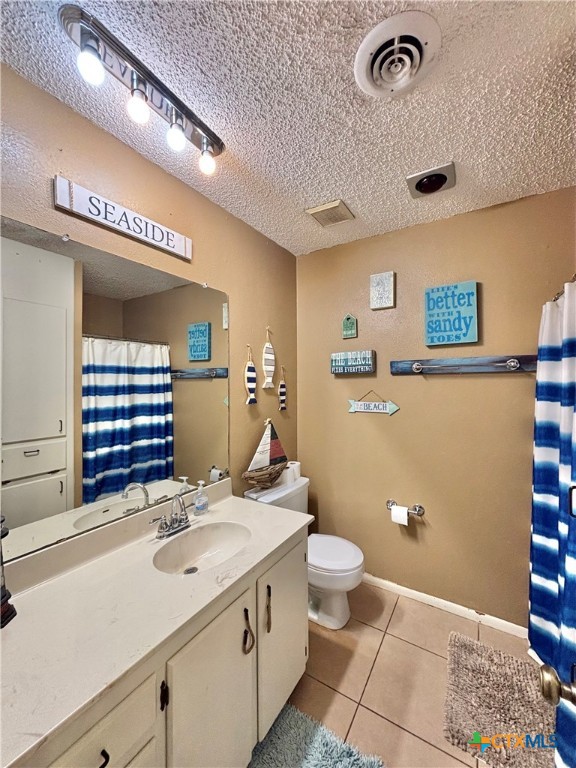 438 15th Street Port O'Connor, TX 77982 - Photo 19 of 26 a bathroom with a sink a toilet and a mirror