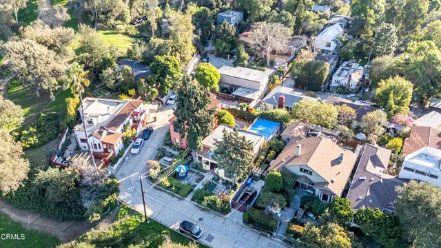 an aerial view of a house with a yard and outdoor space