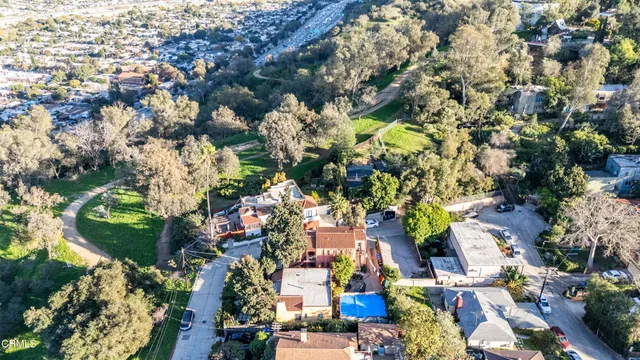 an aerial view of residential houses with outdoor space