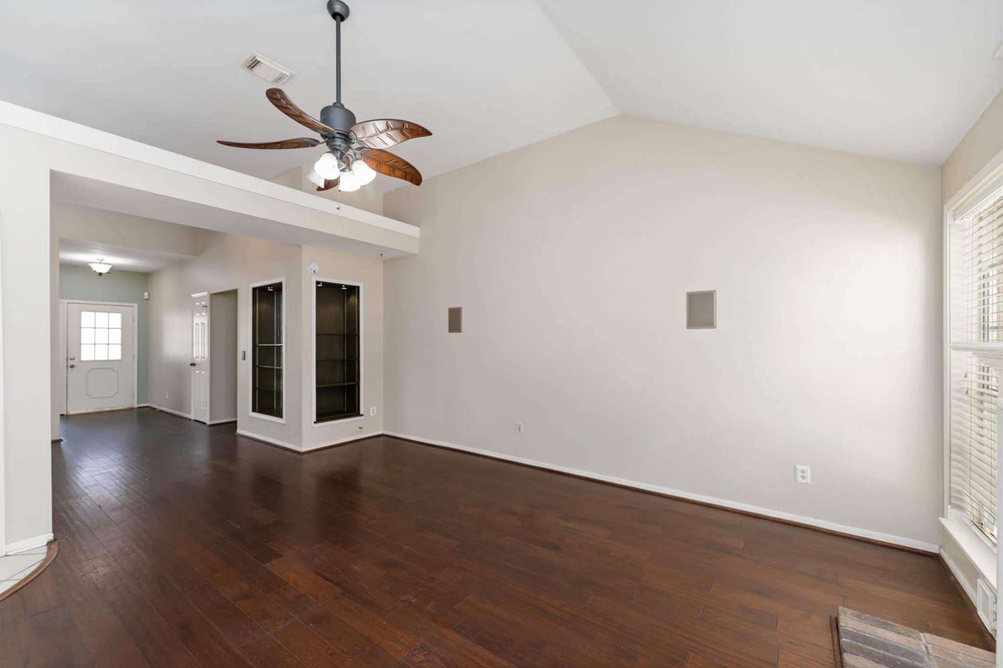 19927 Teller Boulevard Spring, TX 77388 - Photo 15 of 42 a view of an empty room with wooden floor and a ceiling fan