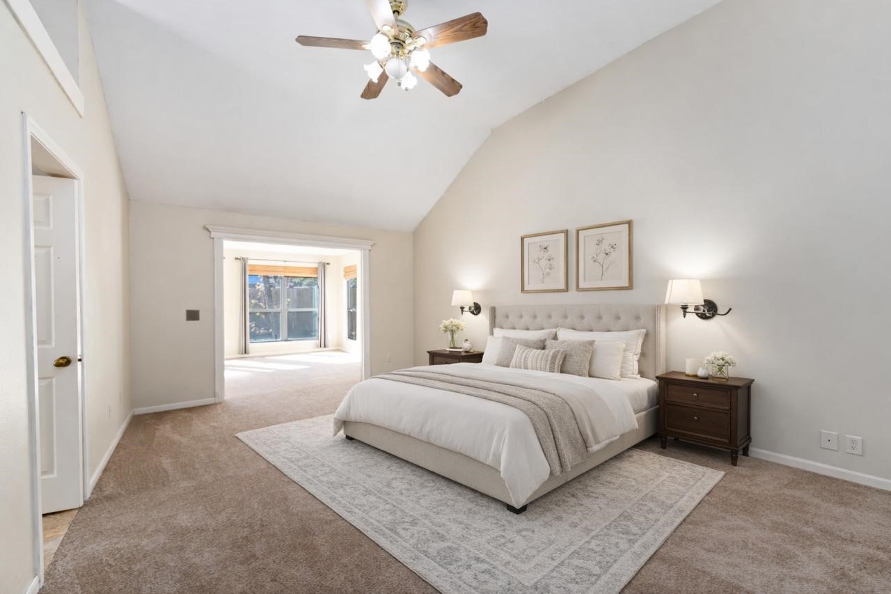 19927 Teller Boulevard Spring, TX 77388 - Photo 17 of 42 a bedroom with a large bed and a chandelier