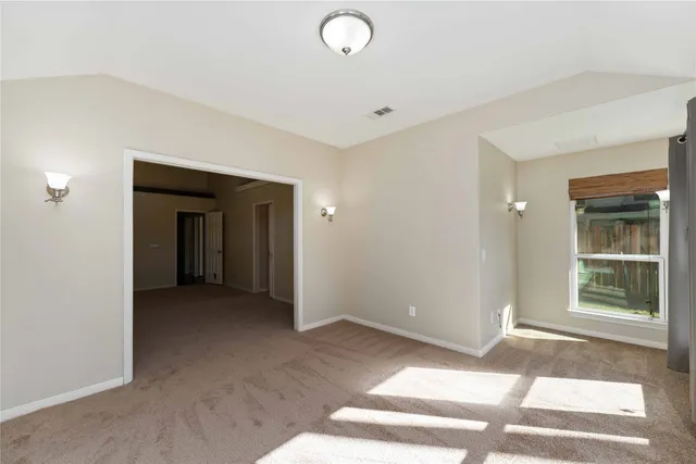 a spacious bathroom with a granite countertop tub sink and mirror