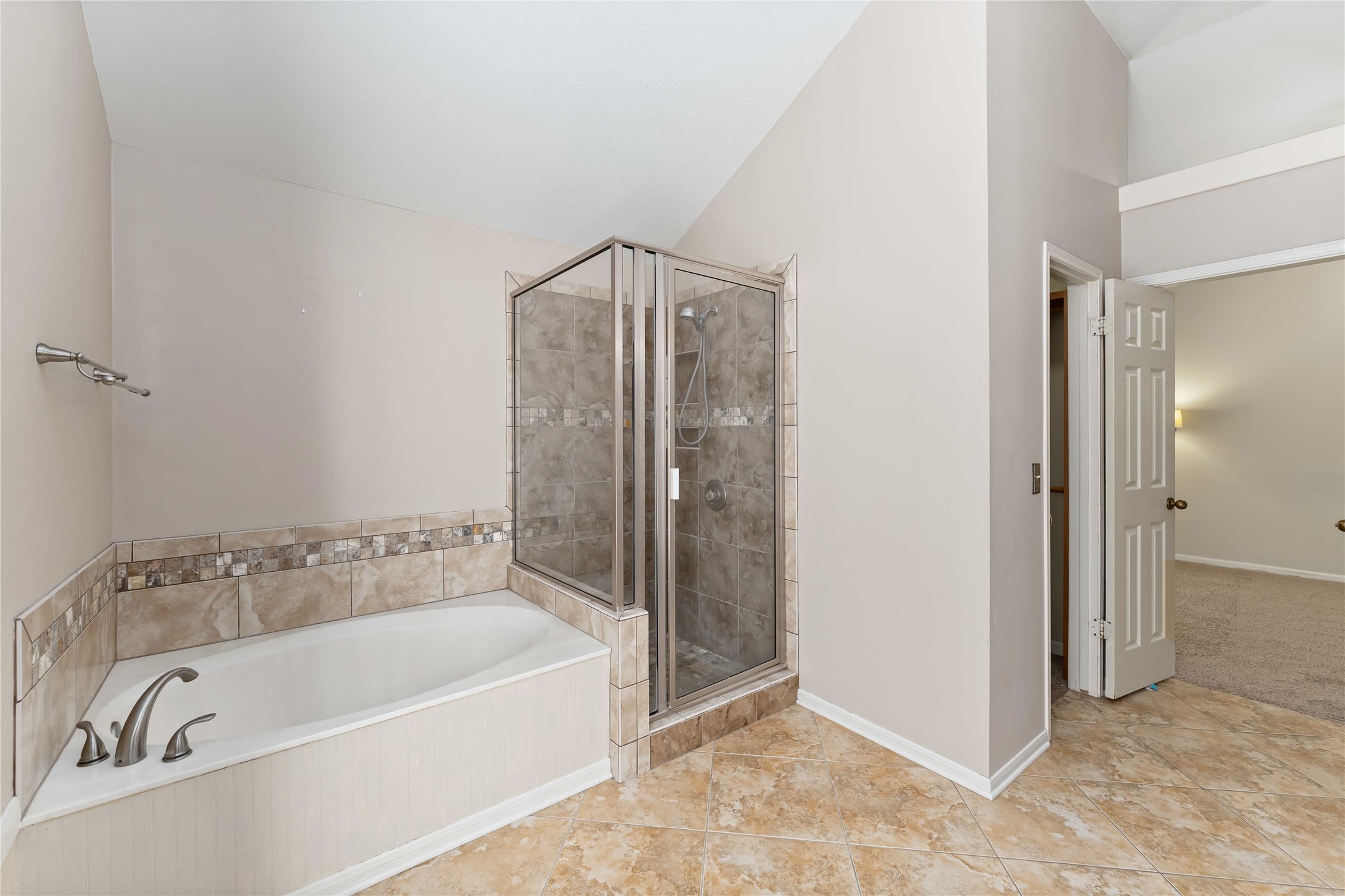 19927 Teller Boulevard Spring, TX 77388 - Photo 25 of 42 a bathroom with a bathtub and a shower